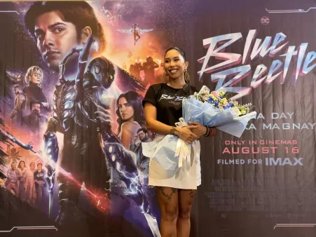 Inka Magnaye receives flowers for Blue Beetle